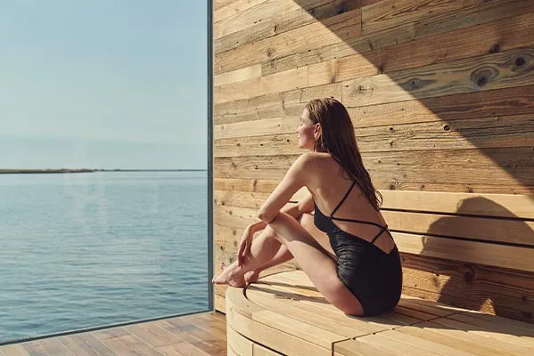 Oceanfront sauna experience at Sky Lagoon geothermal spa in Kópavogur.