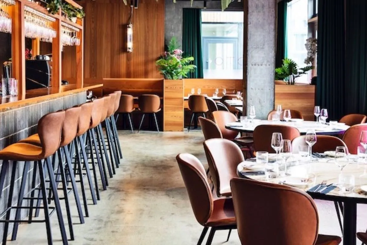 Modern dining room and bar area at OTO Restaurant in Reykjavik, recommended by Handpicked Iceland.