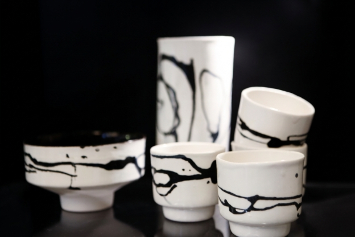 White handmade ceramics with black glaze details at Stilkar in Reykjavík