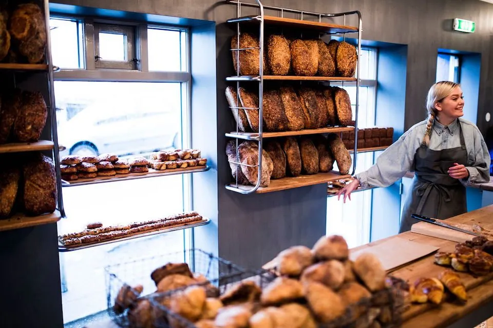 Freshly baked organic sourdough loaves and signature cinnamon rolls at Brauð & co. – Organic Bakery in Reykjavik.