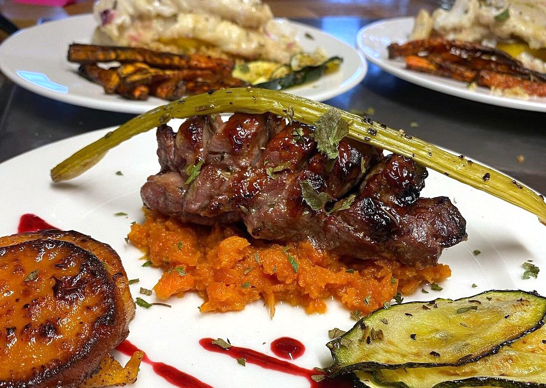 A sophisticated meat and vegetable dish served at Eyri Restaurant in Hjalteyri.