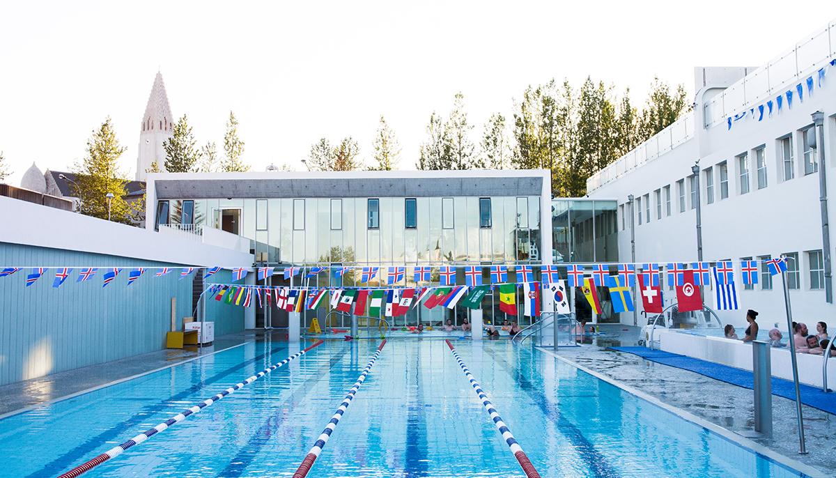 Outdoor swimming lanes and geothermal baths at Sundhöll Reykjavík pool.