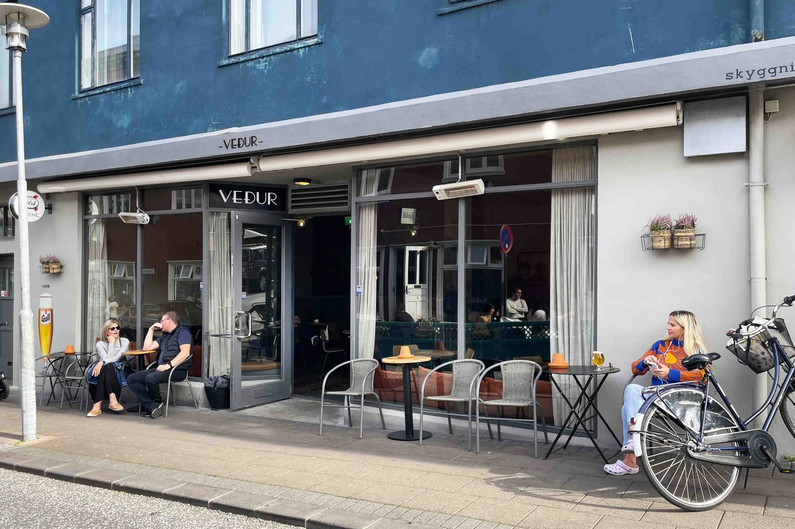 Outdoor seating and entrance of Weather Bar – Veðurbarinn in Reykjavik.