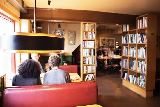 Interior of Grái Kötturinn, a famous library-style cafe in Reykjavik.