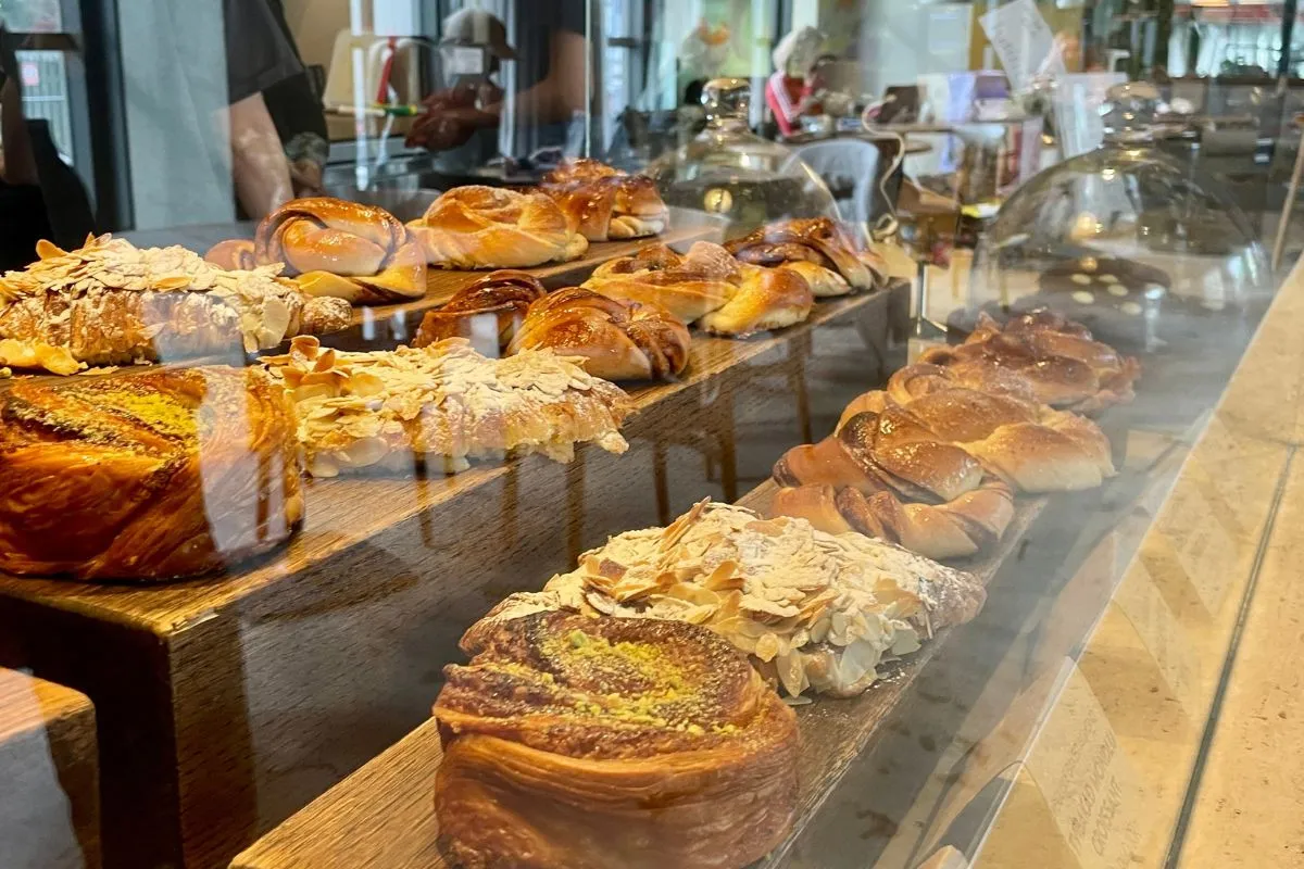 Freshly baked pastries and almond croissants on display at Hygge Café & Micro Bakery in Reykjavik.