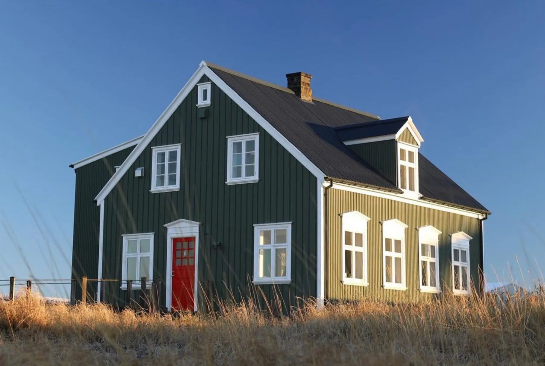 Ráðagerði Restaurant building and scenic coastal landscape on Seltjarnarnes peninsula in Reykjavik.