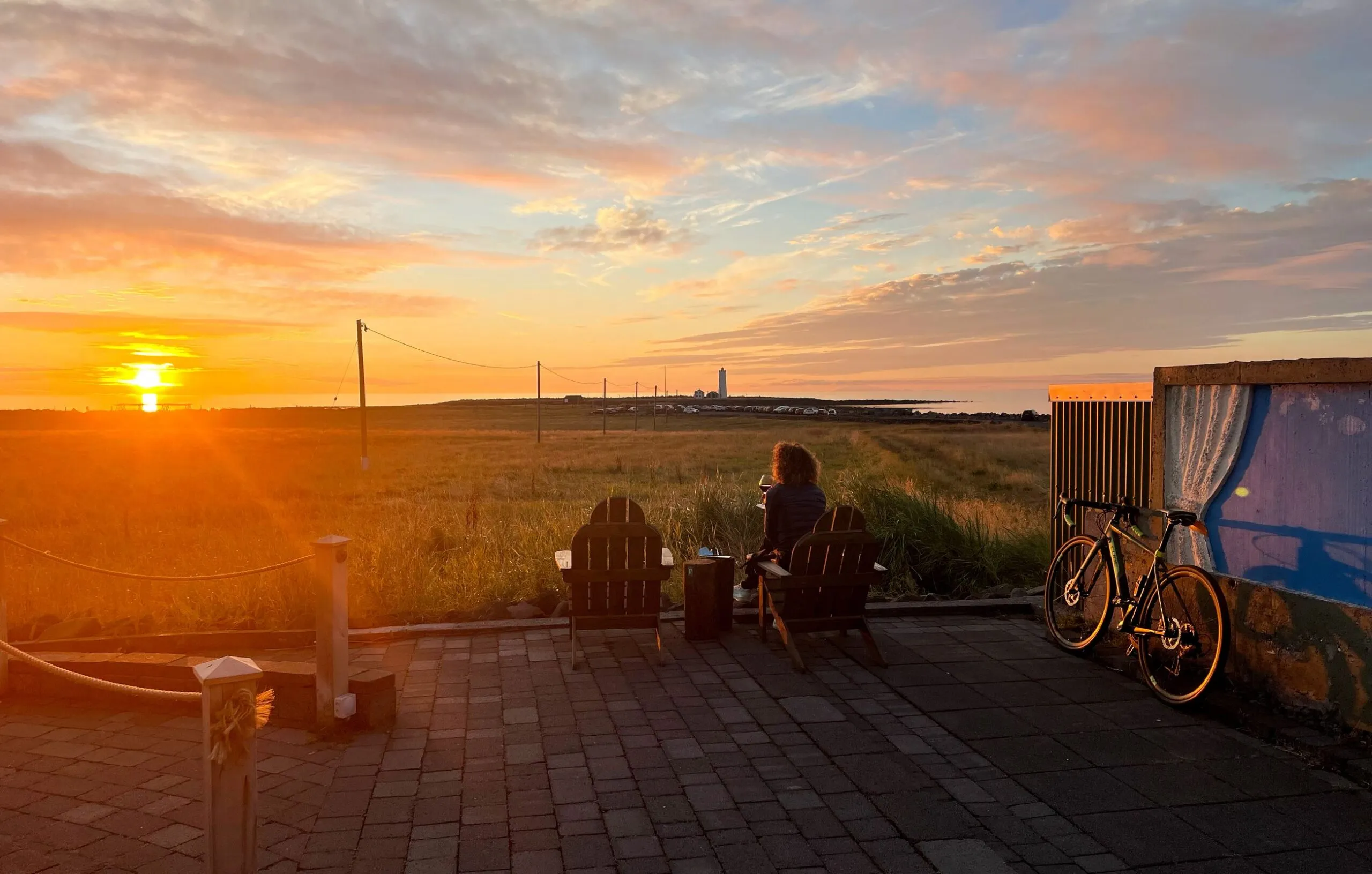 Scenic sunset view and outdoor patio at Ráðagerði Restaurant, Reykjavik.