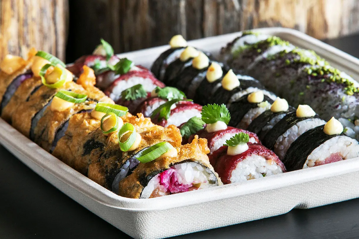Assorted sushi rolls with tempura, fresh tuna, and herb-crusted maki at Sjávargrillið Seafood Grill Reykjavik.