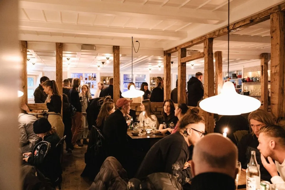Cozy evening atmosphere with customers at Baka Baka, a popular Reykjavik bakery and bistro.