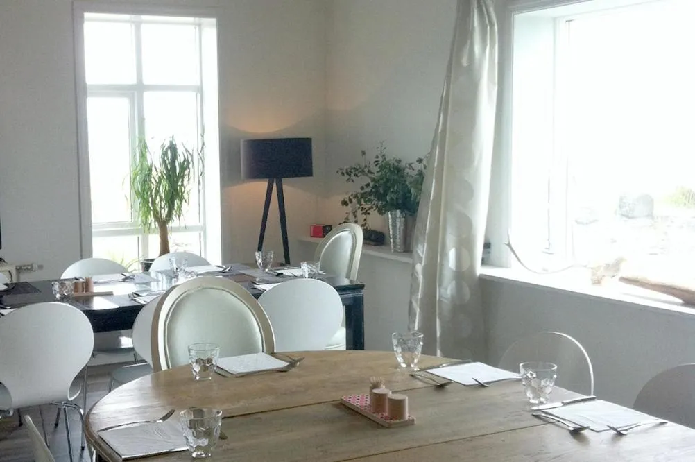 Interior and dining setting at Brimslóð Atelier in Blönduós, recommended by Handpicked Iceland.