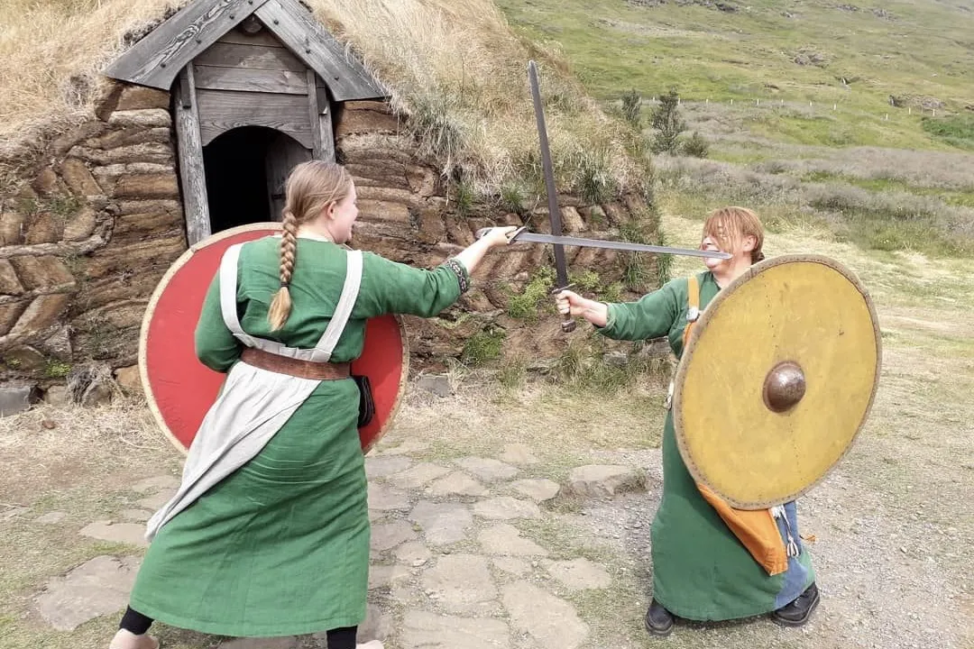 Visitors experiencing Viking history at Eirík the Red's Viking Farm in Búðardalur, West Iceland, recommended by Handpicked Iceland.