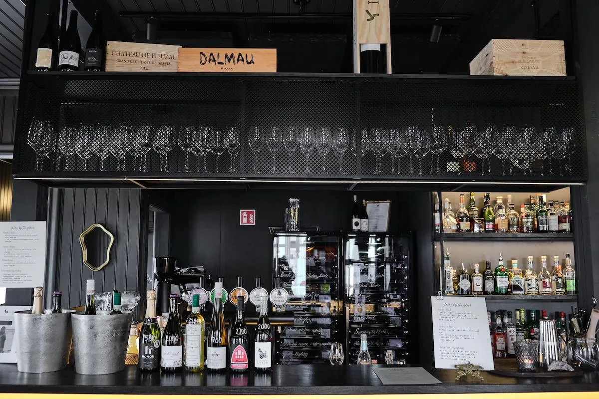 Modern bar counter with wine display at Eyja Wine Bar and Bistro in Akureyri