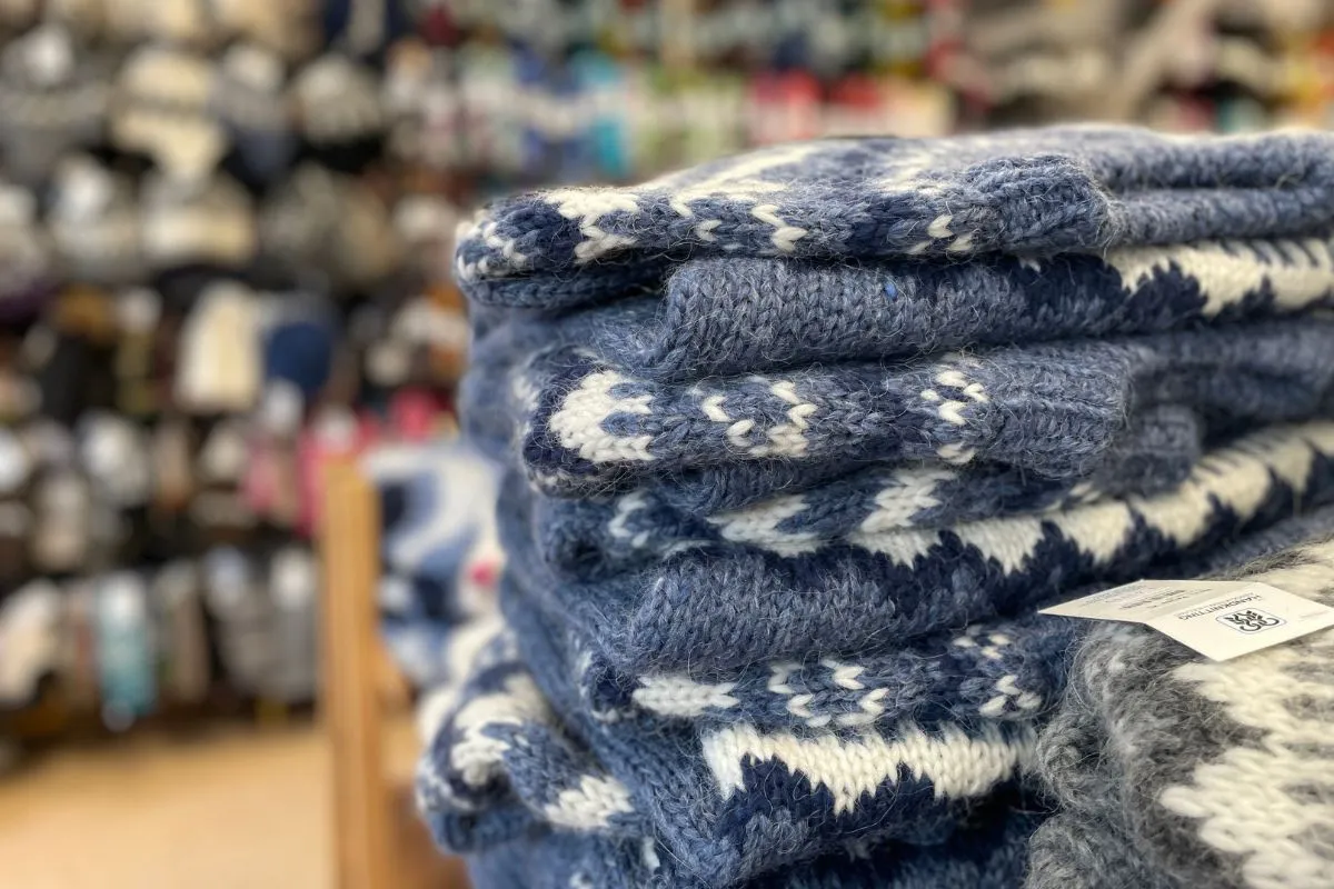 A stack of blue and white hand-knitted Icelandic wool sweaters at The Handknitting Association of Iceland, Reykjavik.