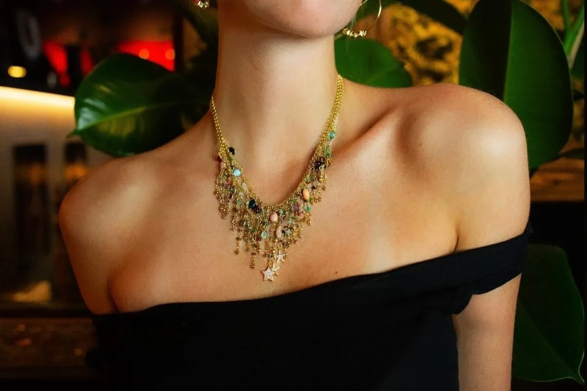 Star charm necklace with colorful gemstones by Icelandic designer Hildur Hafstein.