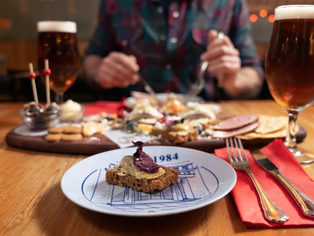 Icelandic rye bread appetizer with local beer and gourmet platter at The Icelandic Bar (Íslenski barinn) in Reykjavik.