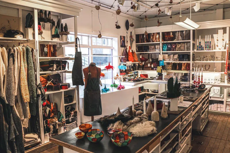 Inside Kirsuberjatréð Reykjavik, featuring unique sustainable design pieces and handmade items.