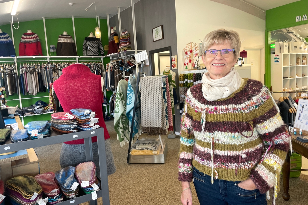 Handmade wool garments and vendor inside Ljómalind in Borgarnes