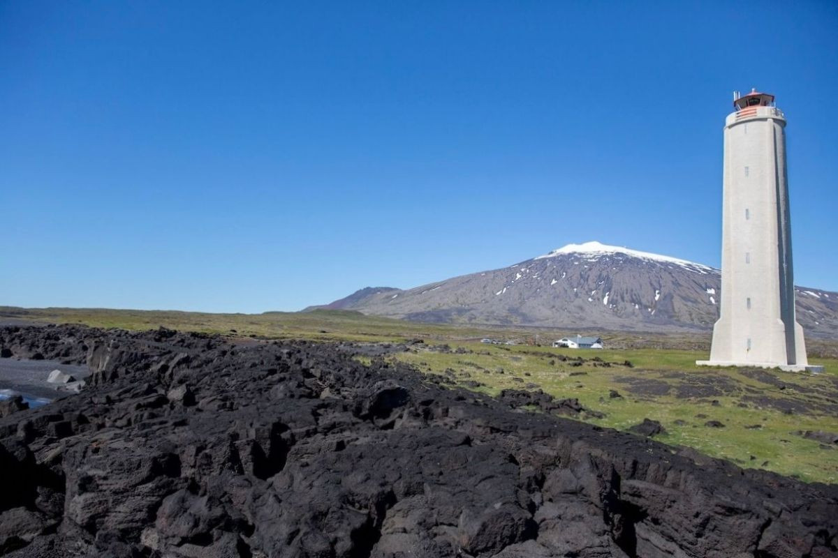 Malarif lighthouse with mountain backdrop in Snæfellsbær.