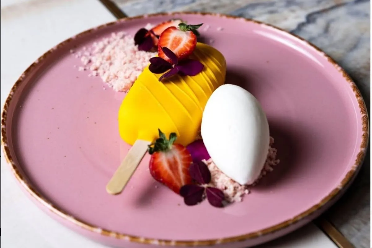 Mango dessert bar on a stick with flavored crumbles at Monkeys Reykjavik.