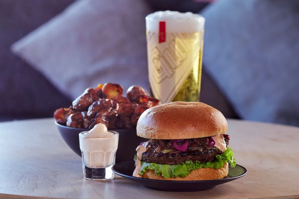 Burger, roasted potatoes, and beer at Midgard Restaurant, Hvolsvöllur.