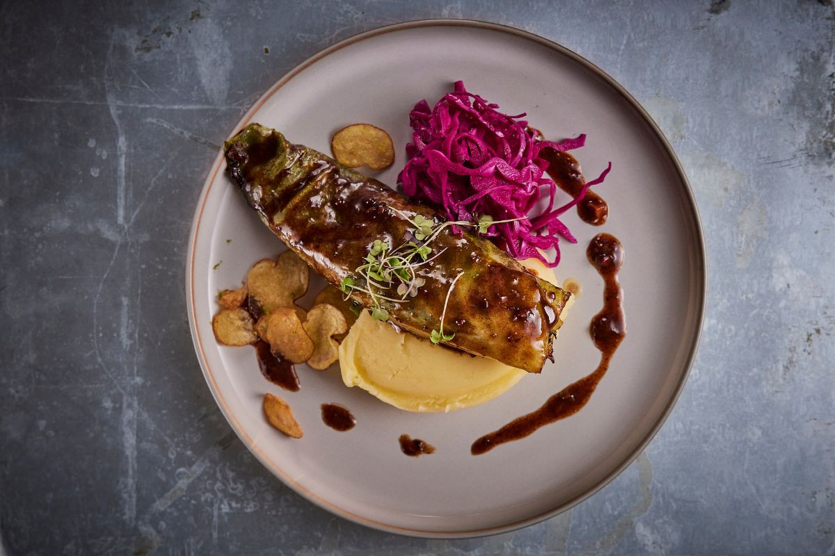 Plated dish with mash and red cabbage at Midgard Restaurant, Hvolsvöllur.