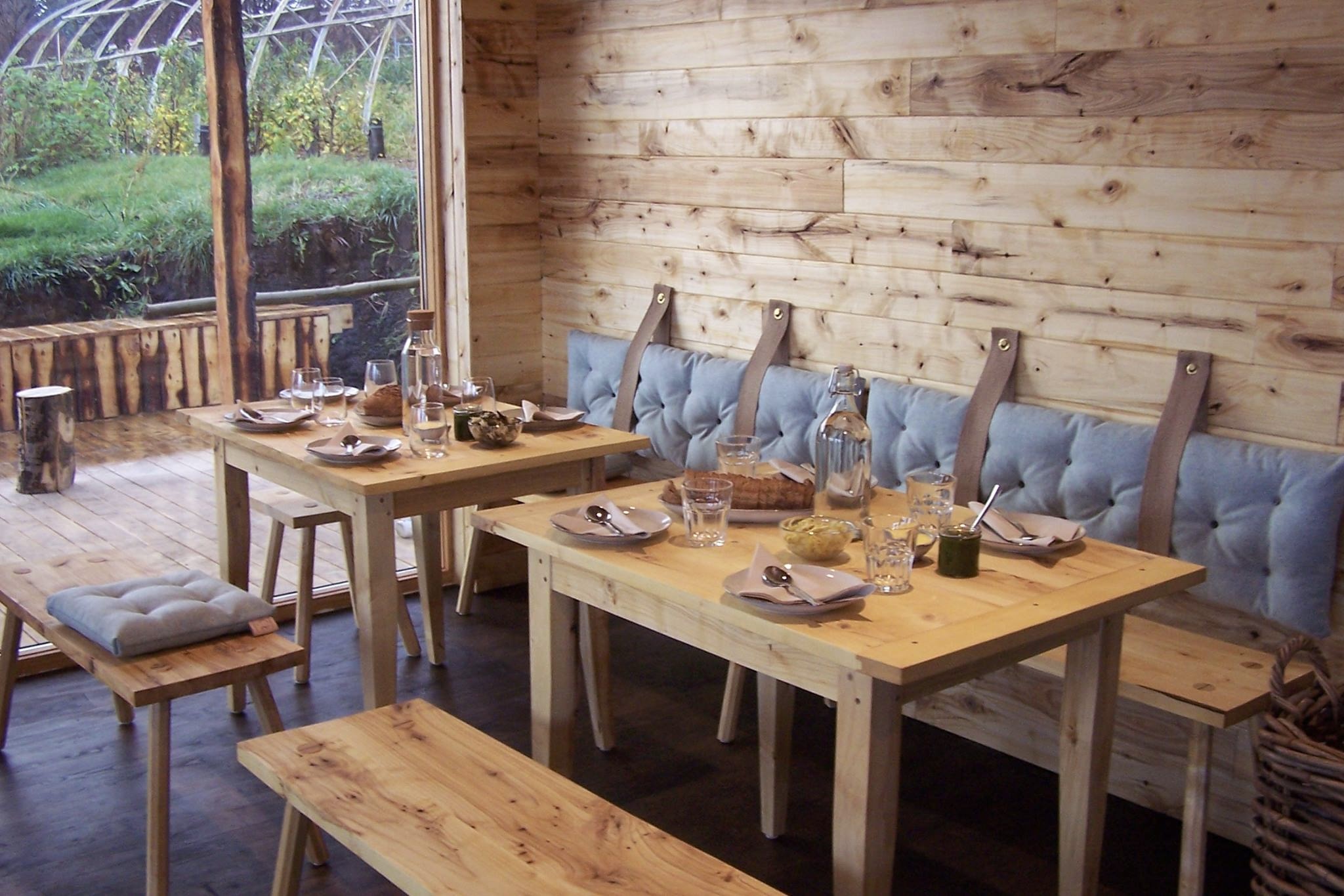 Cozy wooden interior of Móðir Jörð organic café in Egilsstaðir.