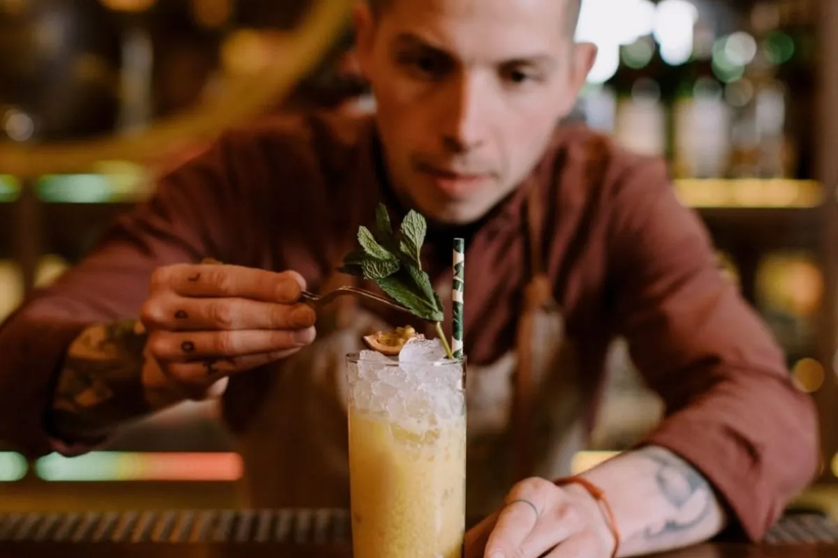 Craft cocktail preparation at Monkeys restaurant.