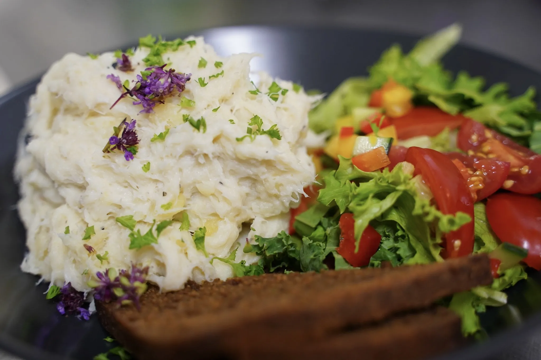 Mashed fish with salad and dark bread at Naustið Seafood Restaurant in Húsavík.