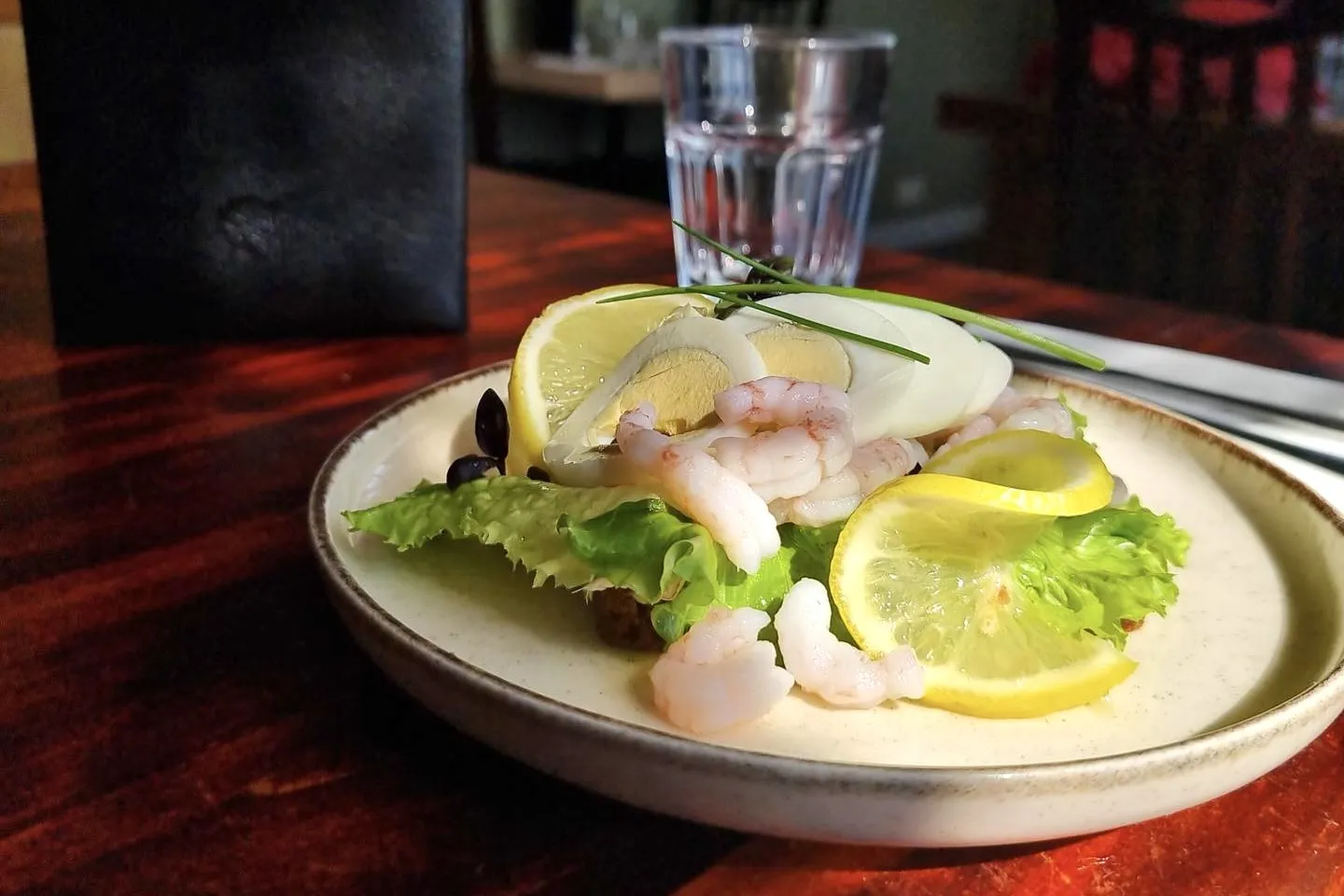Plated seafood dish served at Naustið Seafood Restaurant in Húsavík.