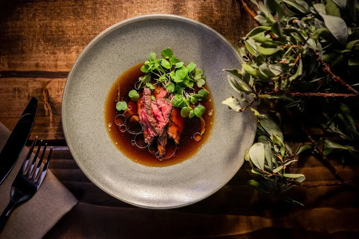 Tender beef and fresh microgreens served North Restaurant in Akureyri.