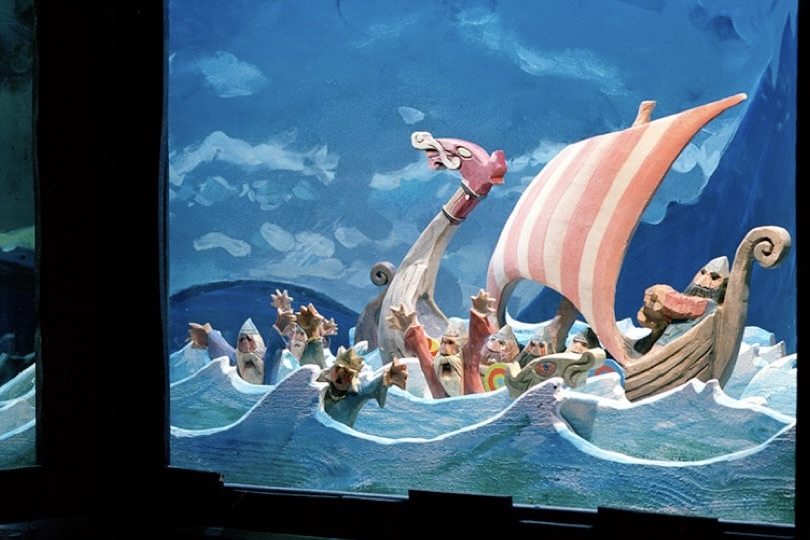 An exhibit from the Settlement Center in West Iceland illustrating the journey of the first settlers through hand-carved wooden sculptures and painted scenery.