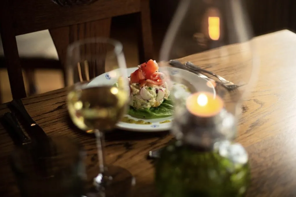 A traditional Moroccan salmon tajine served at Siglunes guesthouse in Siglufjörður, recommended by Handpicked Iceland.