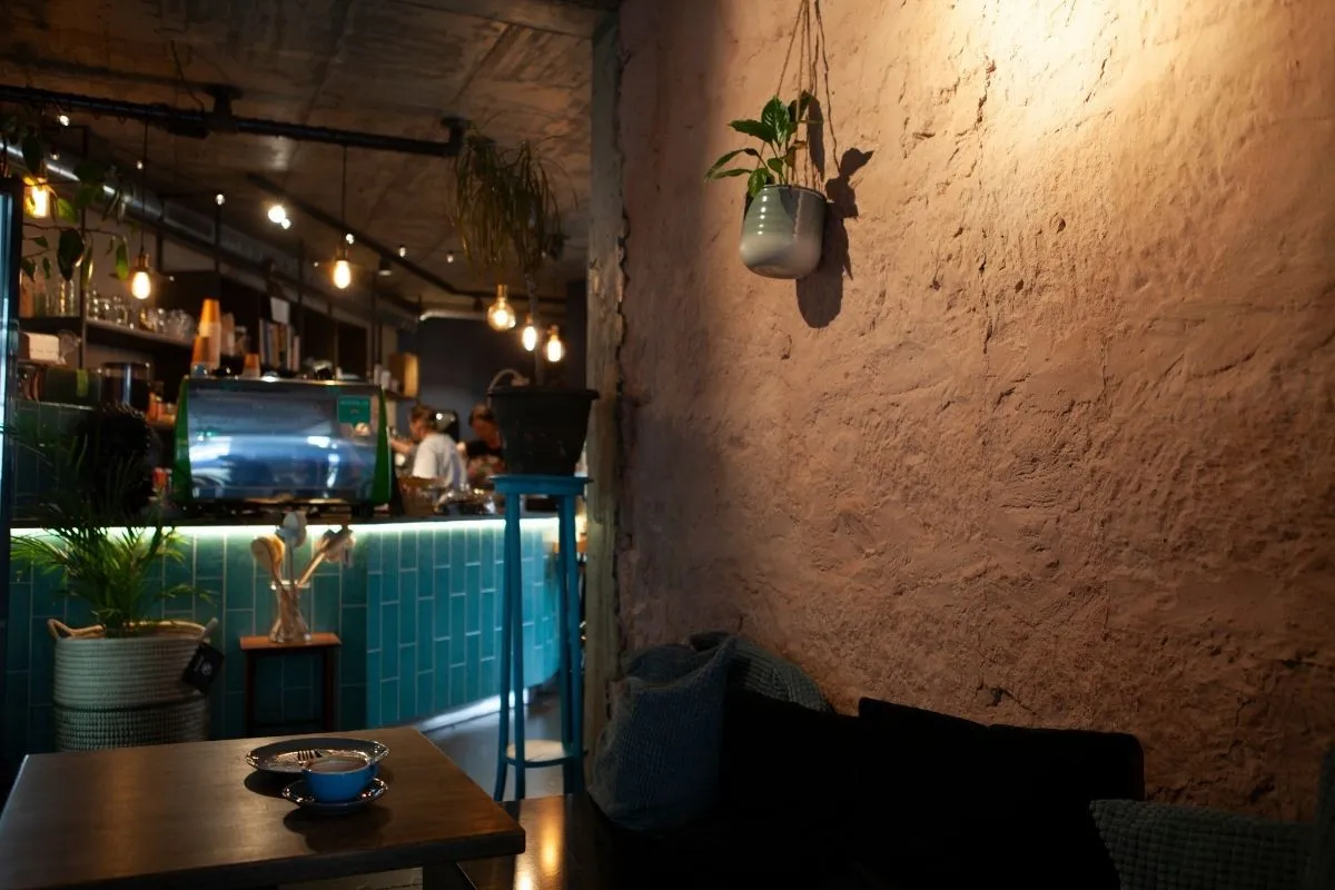 Interior of Systrasamlagið (Sisterhood organic café) with rustic décor and coffee bar in Reykjavik.