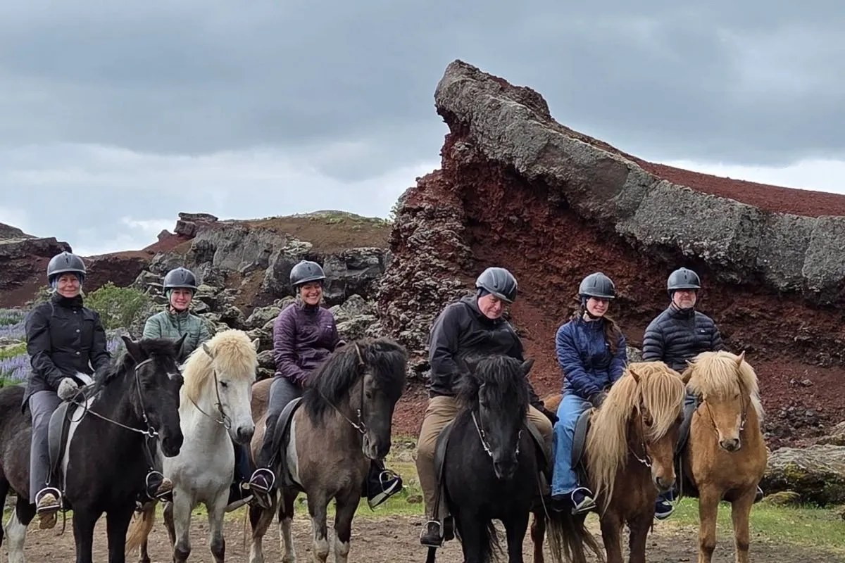 Group of riders with The Icelandic Horse traversing volcanic lava fields near Reykjavik.