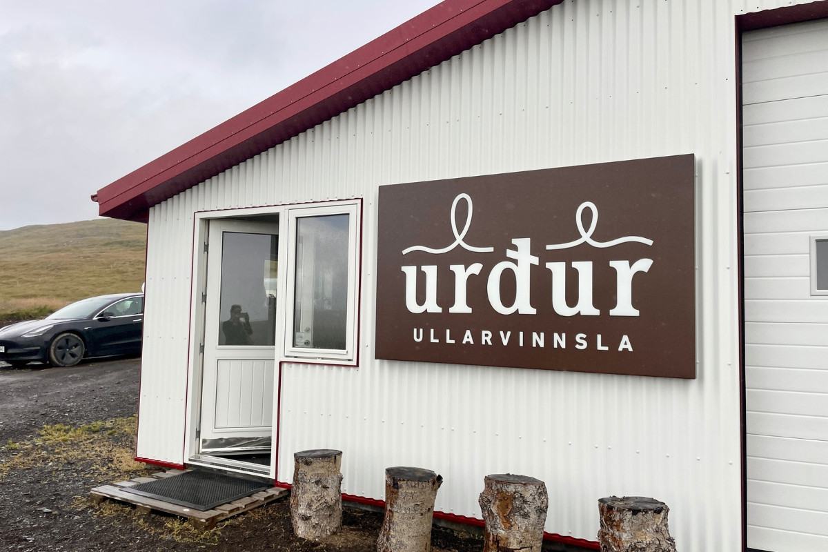 Exterior view of Urður wool workshop building and sign in Búðardalur, West Iceland.