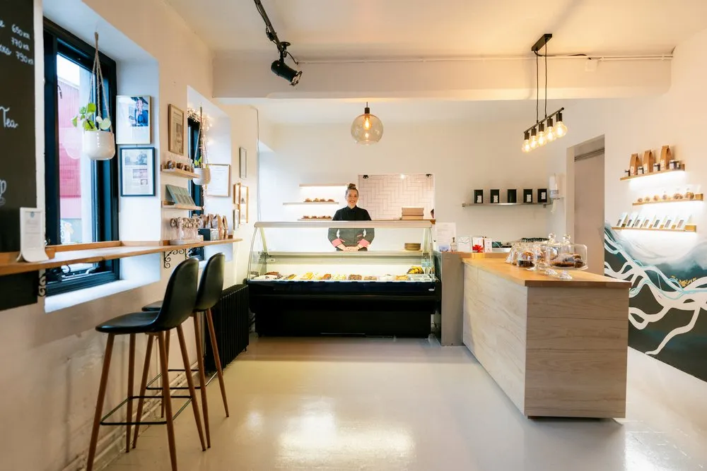 Modern café interior and dessert display at Sweet Aurora Reykjavik.