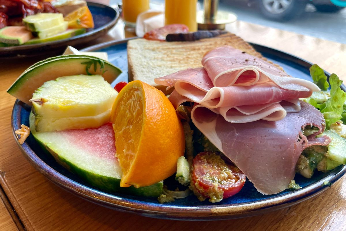Prosciutto and fresh fruit brunch platter at Berlin Café, Akureyri.