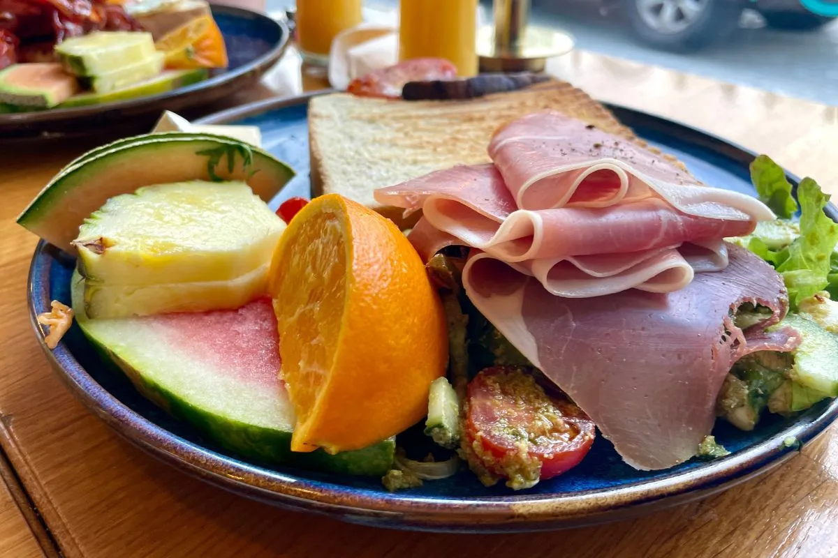 Prosciutto and fresh fruit brunch platter at Berlin Café, Akureyri.