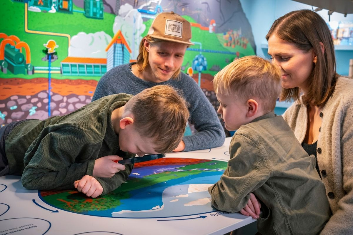 Interactive geothermal display at Hellisheiðarvirkjun with visitors.