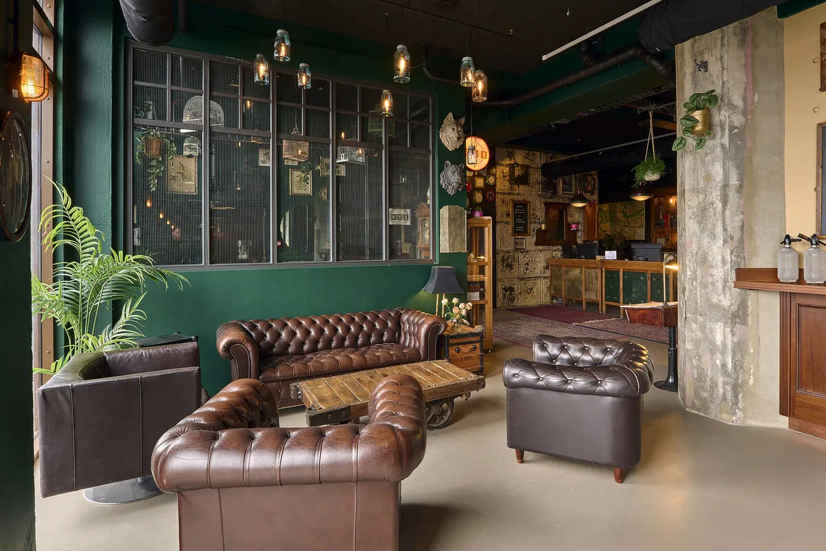 Lounge with brown leather sofas and armchairs