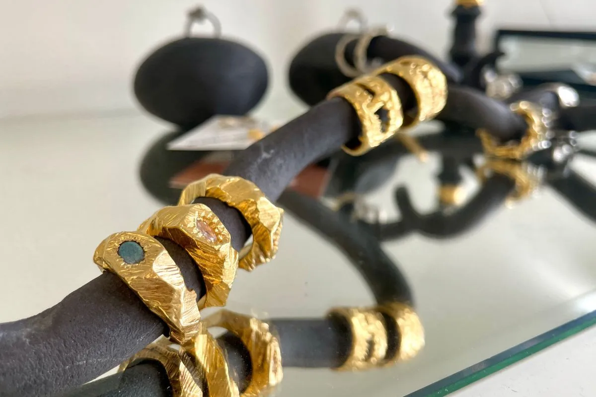Gold designer jewelry on display at Kiosk fashion boutique in Reykjavik.