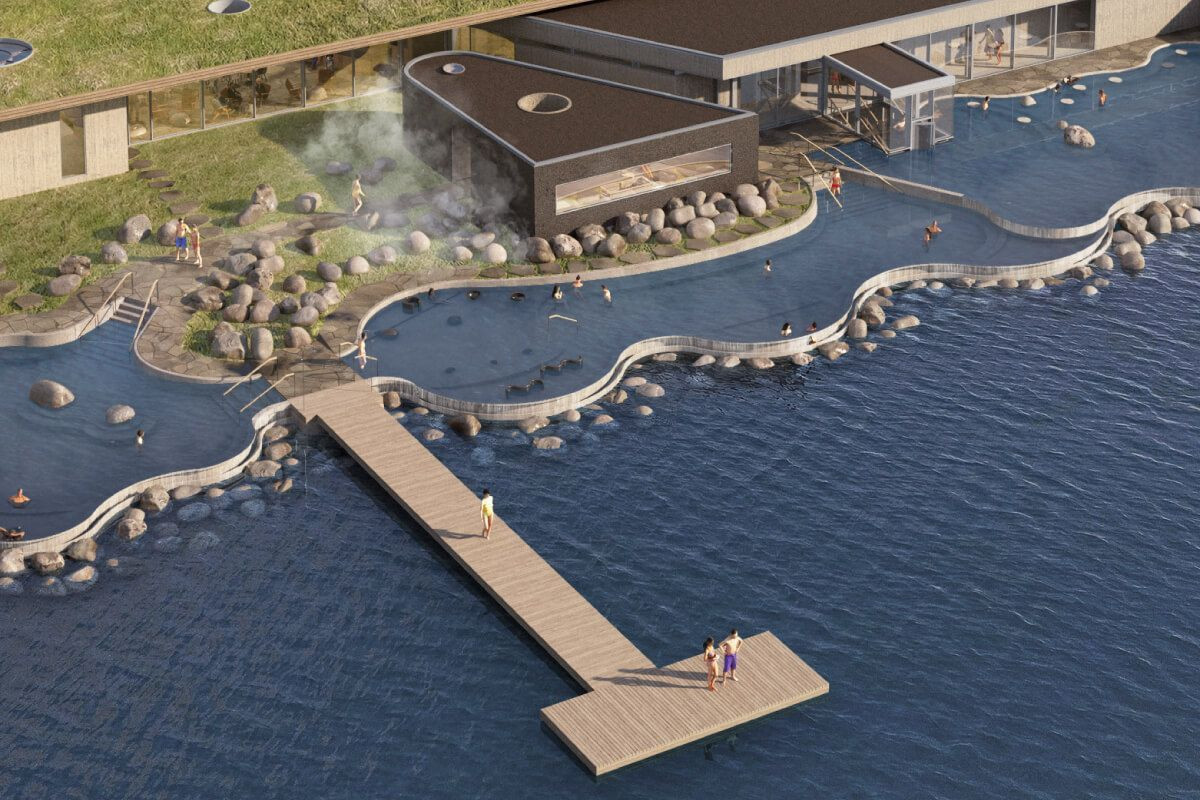 Aerial view of outdoor pools and a wooden dock at Laugarvatn Fontana.