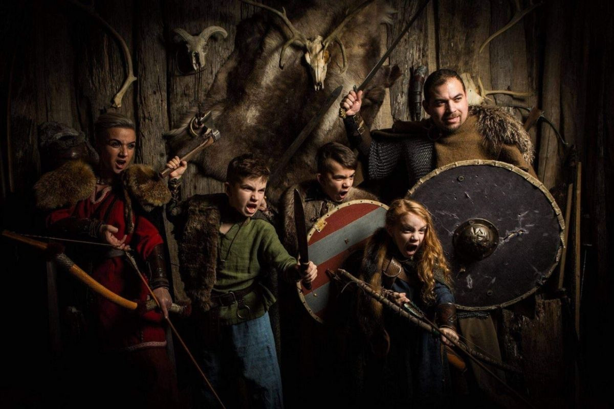 Viking family portrait in traditional Norse costumes at Mink Viking Studio in Reykjavik.