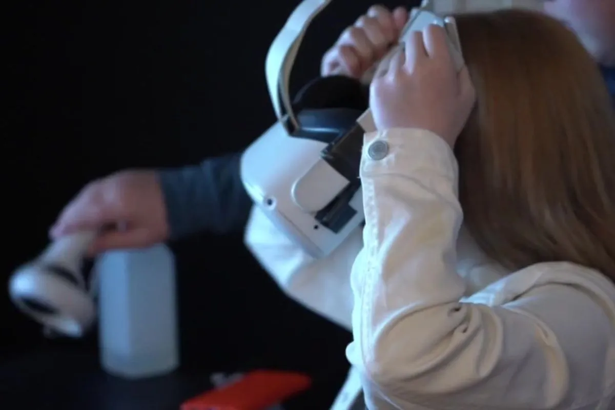Visitor trying a VR experience at Skriðuklaustur History Center.