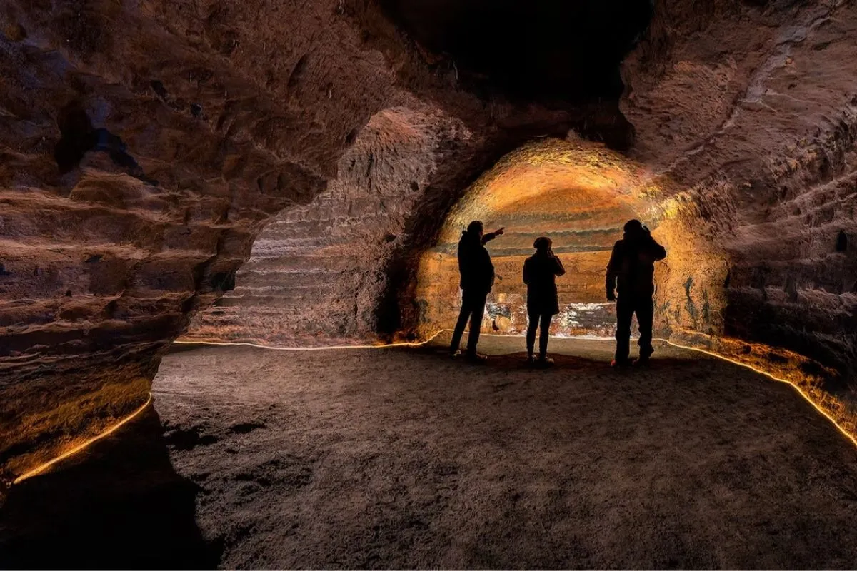 Guided tour through the illuminated Caves of Hella in South Iceland.