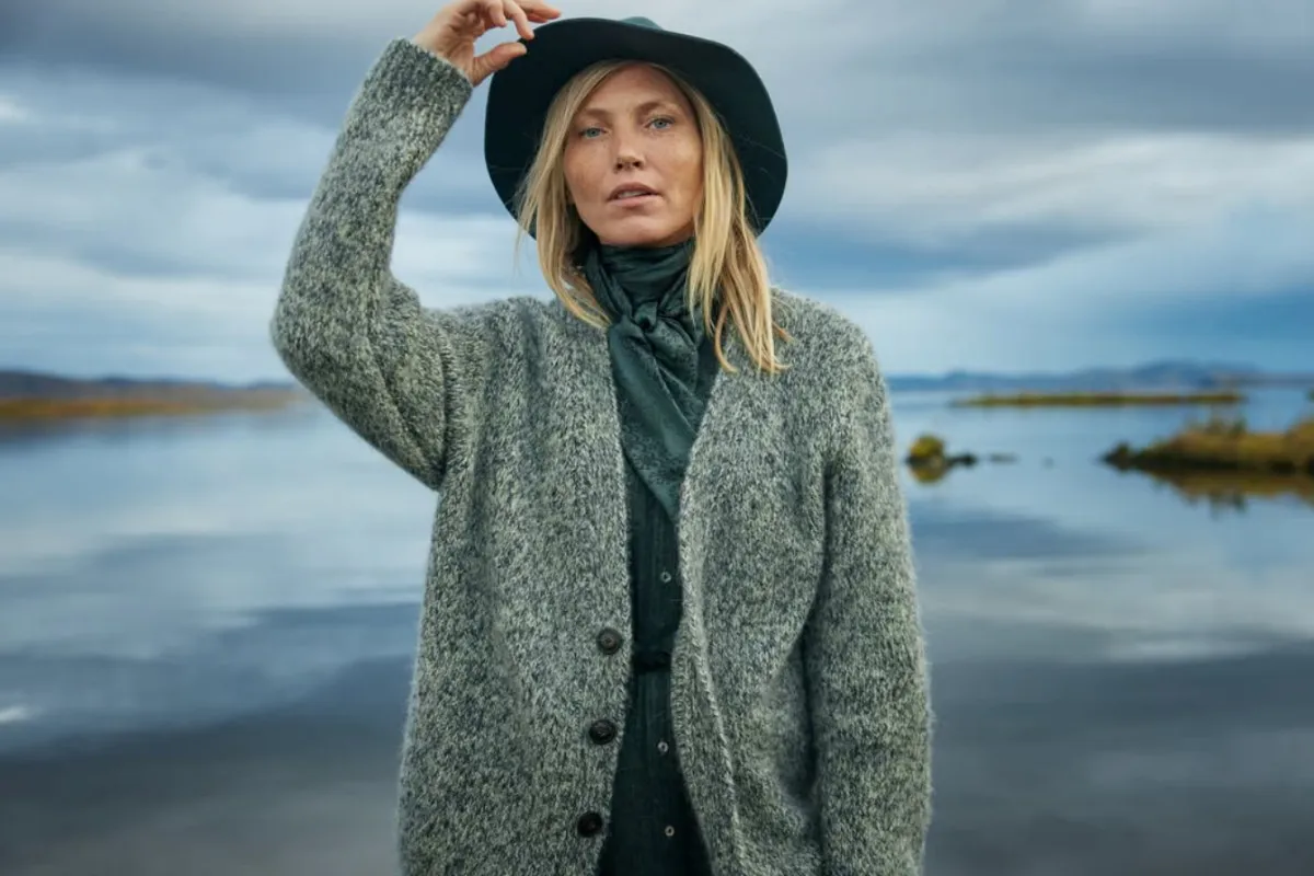 Icelandic wool apparel for women displayed in a coastal landscape by Farmers & Friends.