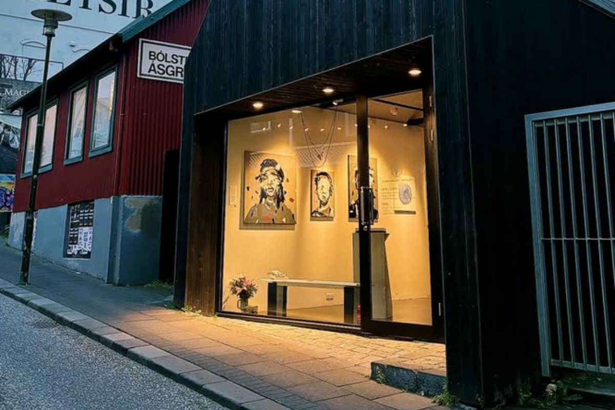 Art exhibition at RAF Gallery, Reykjavik, visible through a large glass window on a street corner, recommended by Handpicked Iceland.