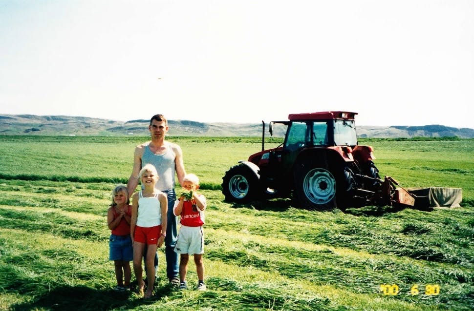 Young Arnar Bjarni Eiríksson on a tractor at Gunnbjarnarholt farm