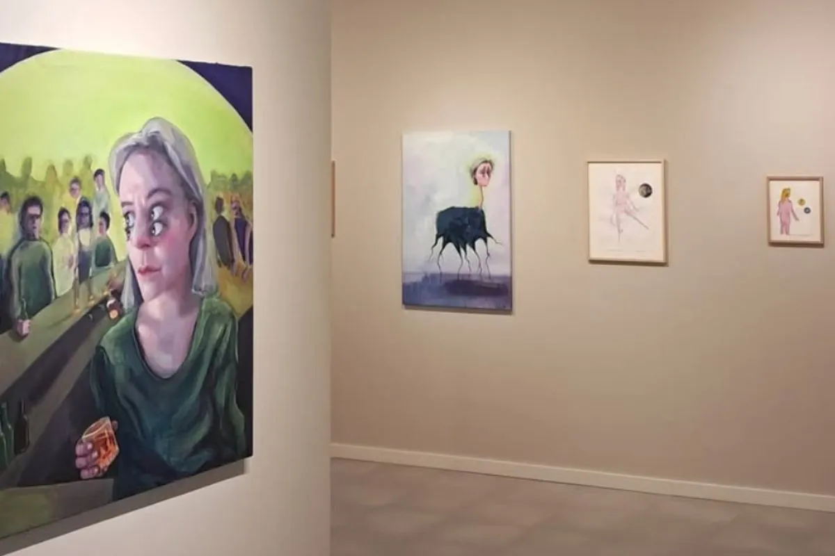 Interior of Gallery Fold in Reykjavik with surrealist artwork on display, recommended by Handpicked Iceland.