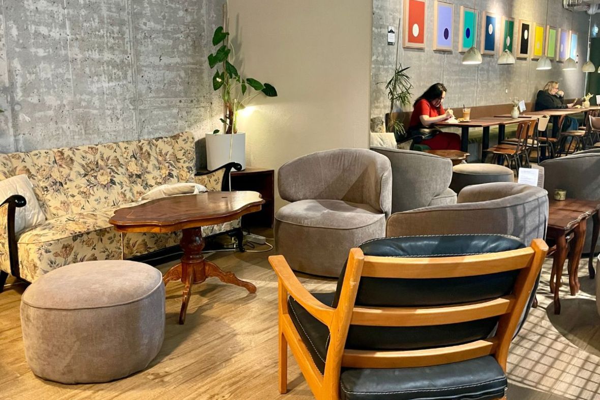 Comfortable lounge chairs and eclectic decor at Hygge Café & Micro Bakery - Barónsstígur.